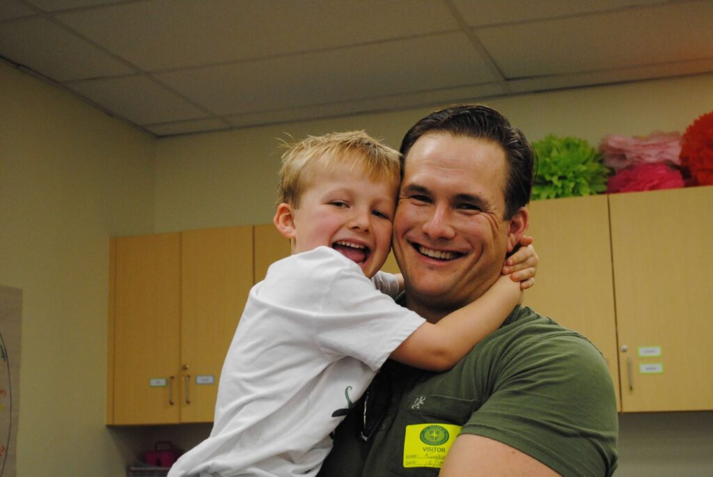 Authentic photo of Robert Kuypers with his son Braden during a joyful family moment