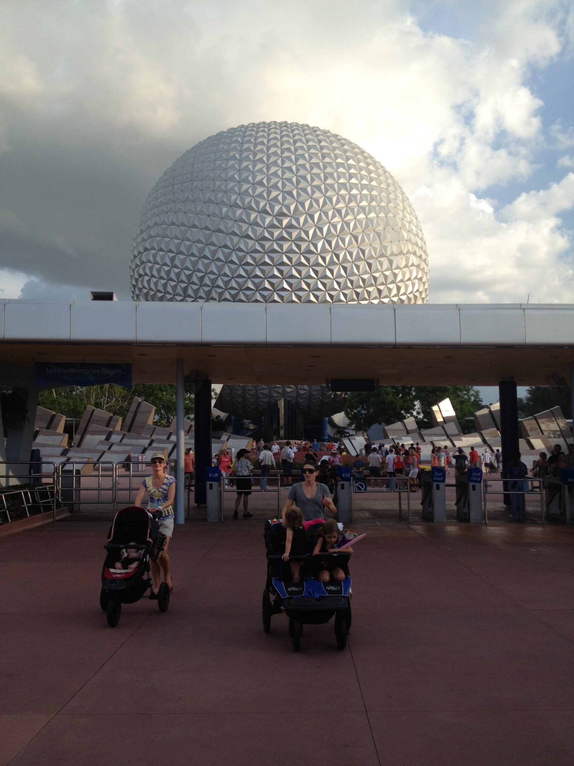 Spaceship Earth and visitors at EPCOT.