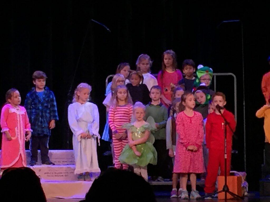 Children gathered for a stage performance.