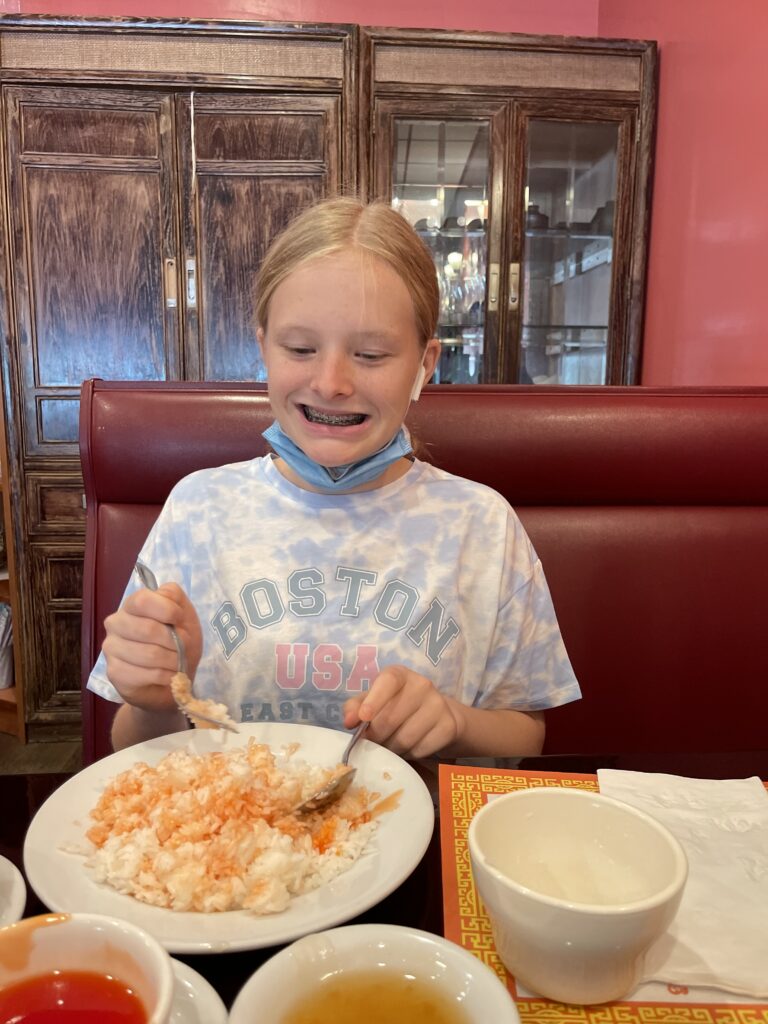 Child enjoying a restaurant meal.