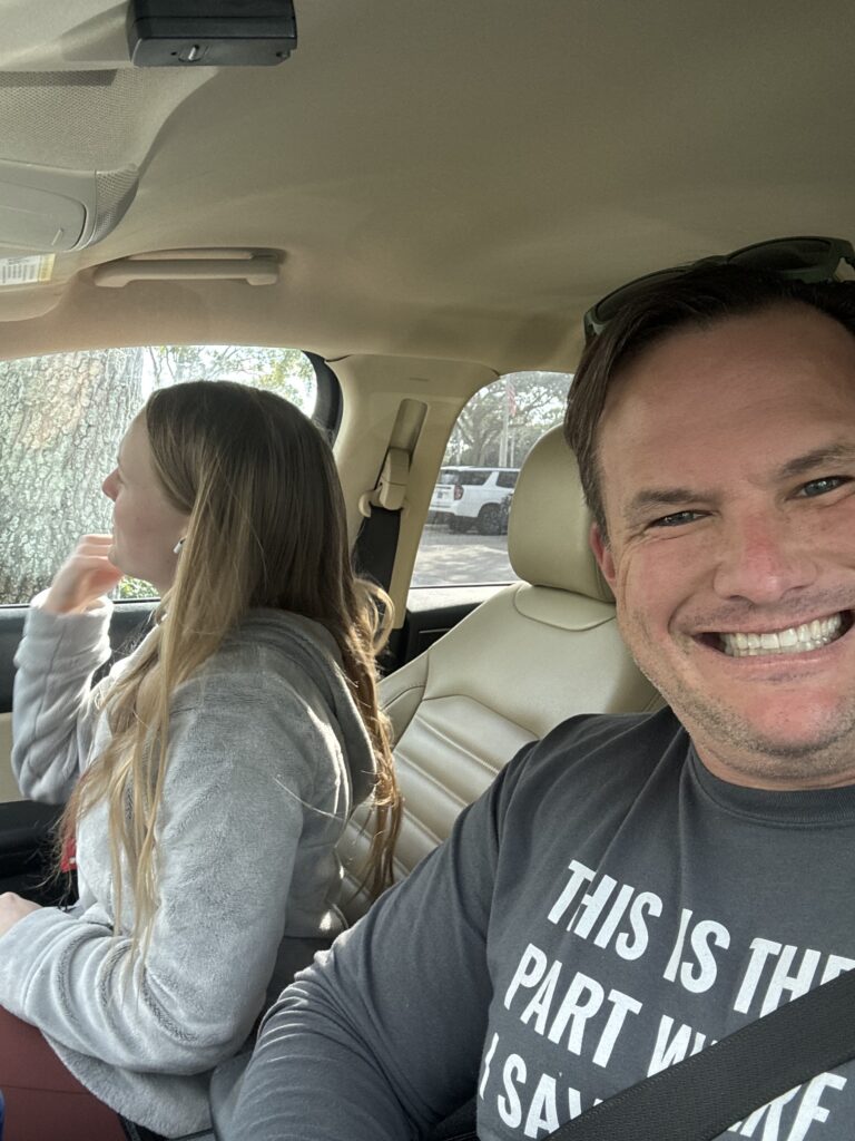 Two adults traveling together in a car.