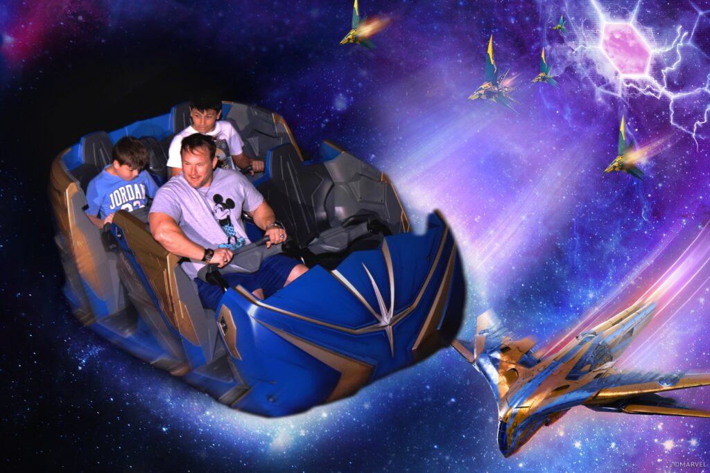 Family riding a space-themed amusement park attraction.