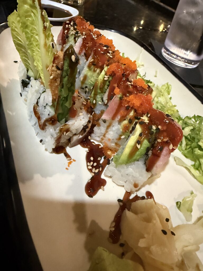 Restaurant dishes served with decorative sauces.