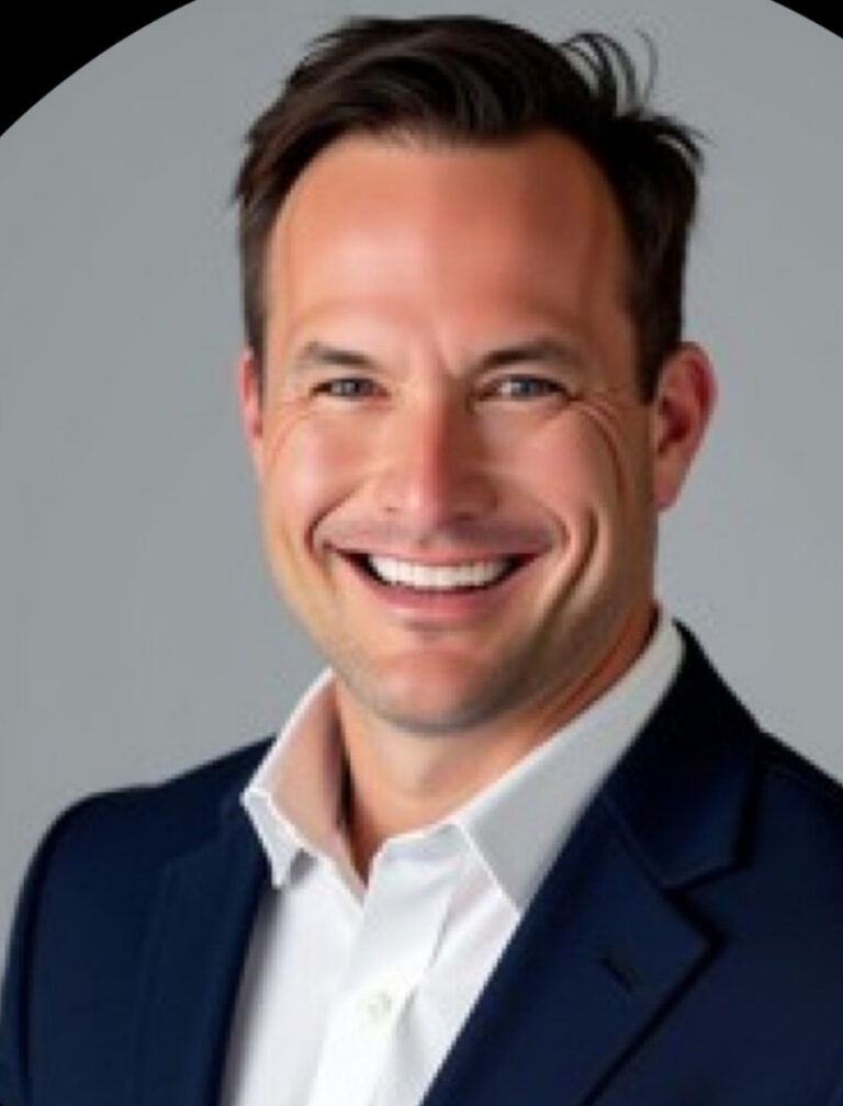 Robert W. Kuypers smiling in a navy jacket and white shirt.
