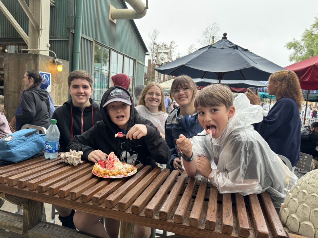 The kids enjoying dessert together on a Disney trip.