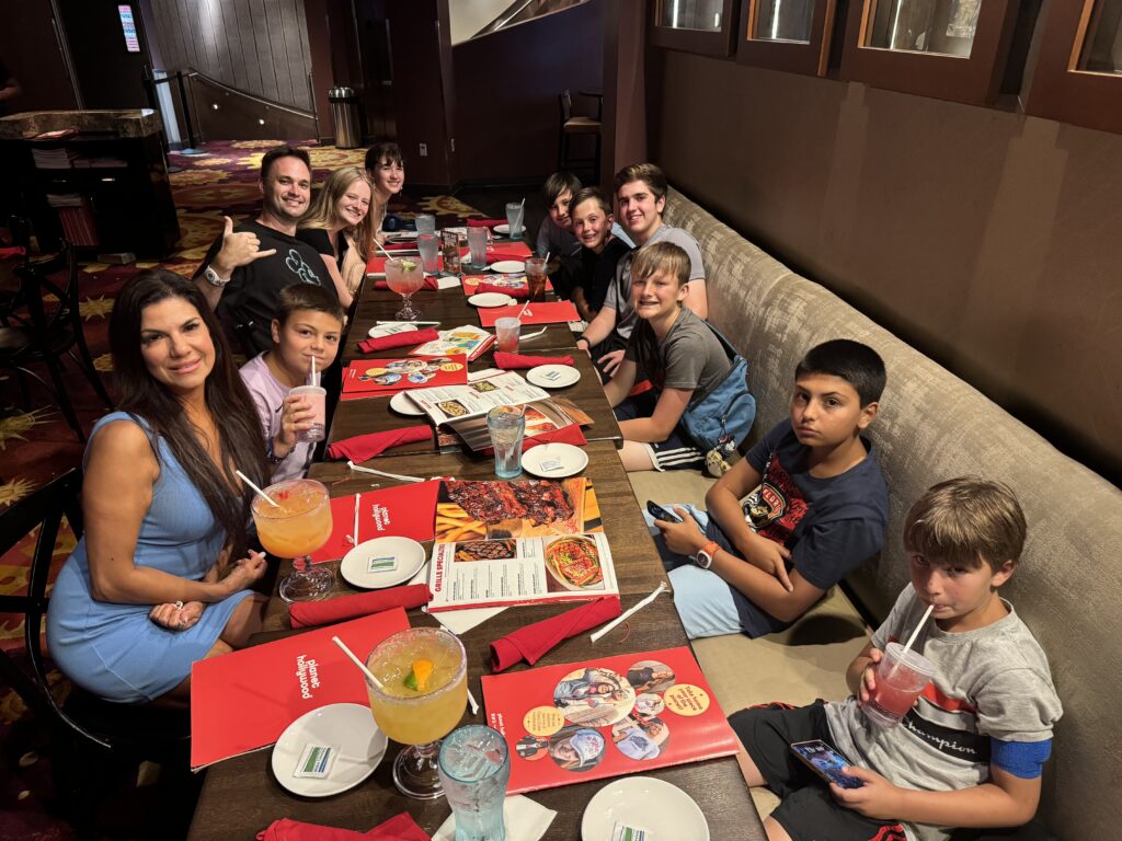 Family and friends sharing a meal at Planet Hollywood.