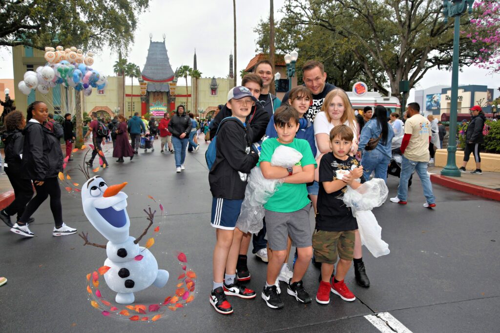 Robert W. Kuypers with the kids and friends at Disney's Hollywood Studios, with Olaf in the foreground.