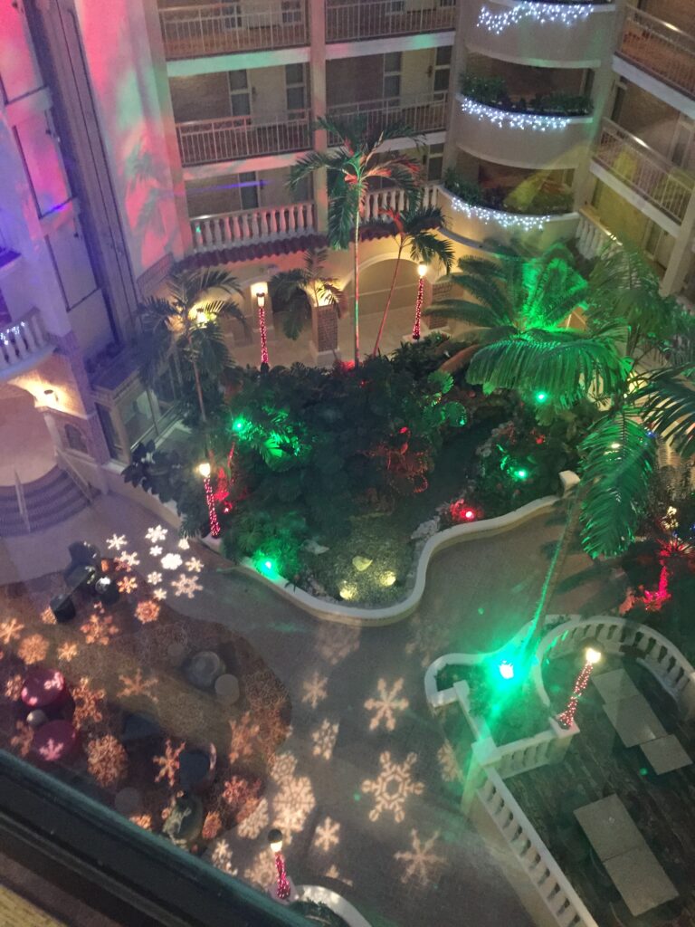 Holiday decorations glow inside a multi-level atrium.