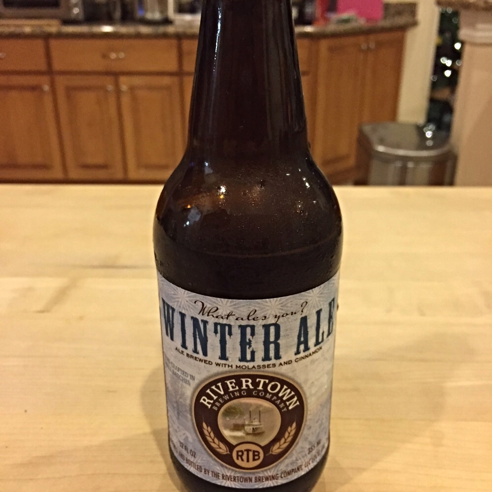 Brown bottle of Winter Ale on a kitchen counter.