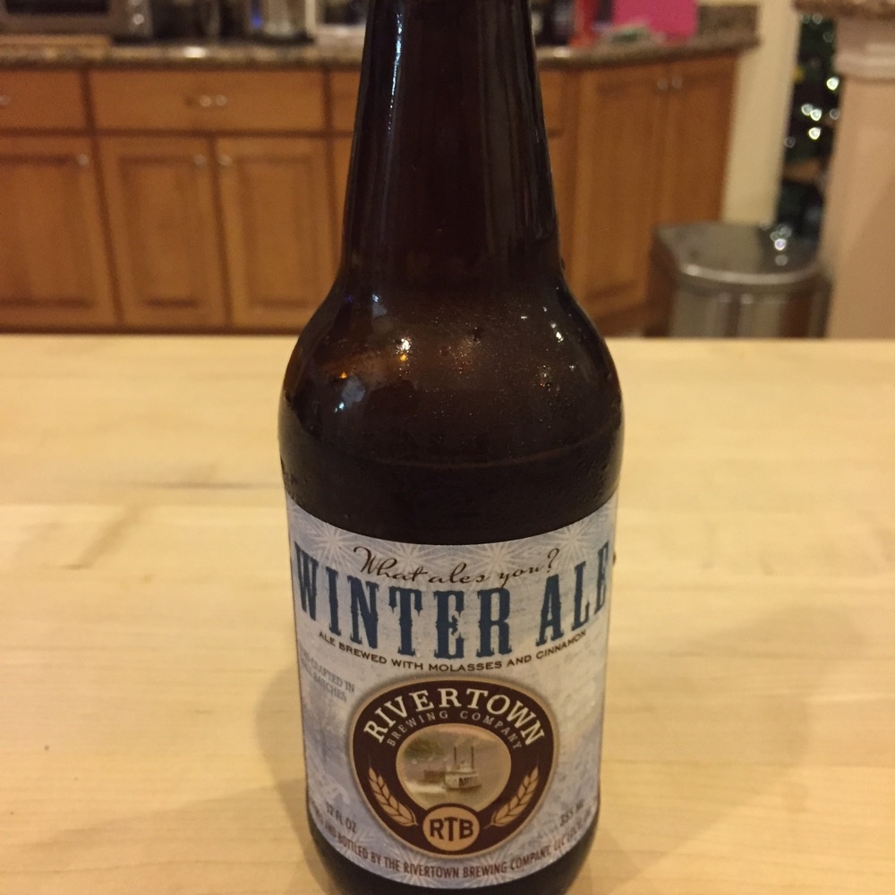 Brown bottle of Winter Ale on a kitchen counter.